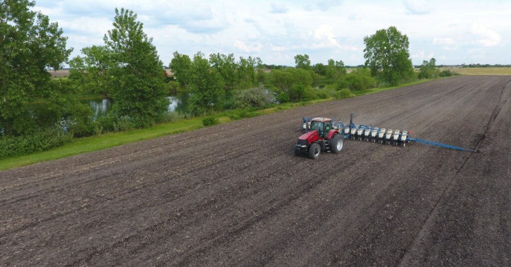 Tractor tilling a field