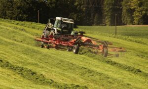 tractor tedding hay