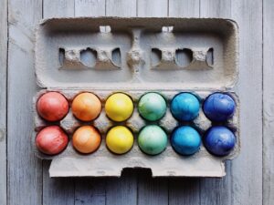 colorful easter eggs in a cardboard carton