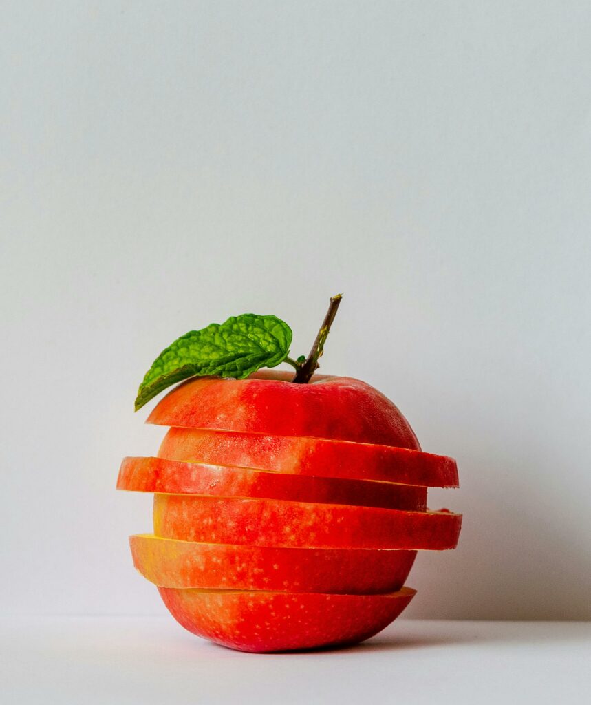 Image of apple that has been sliced across and restacked 